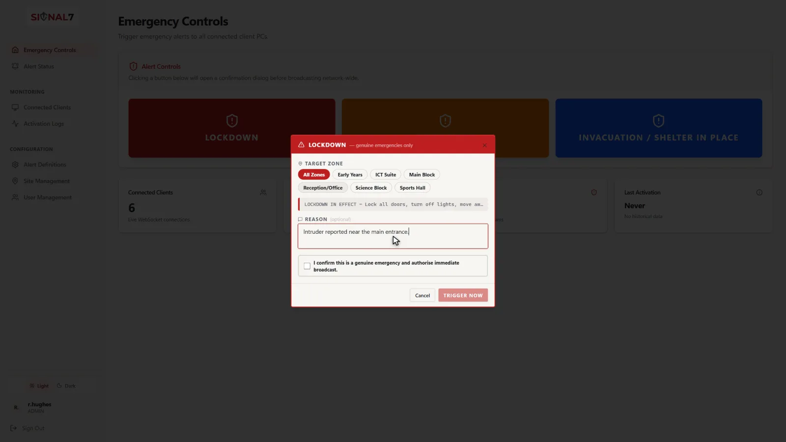 The confirmation dialog Signal 7 shows before any alert is sent: the target zone, the message that will appear, an optional reason, and a tick box reading ‘I confirm this is a genuine emergency and authorise immediate broadcast’ above the Trigger now button.